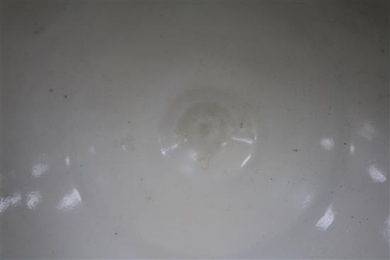 A Chinese cream glazed bowl on stand